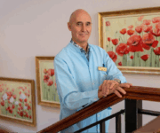Gynecologist and IVF specialist Andrei Sõritsa standing on stairs, looking into camera.